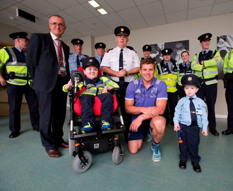 Garda Ceejay McArdle and Garda Jordan Perez with Munster and Ireland rugby star CJ Stander; Niall Maloney, operations director, Shannon Airport; and Chief Superintendent John Kerin. Photo: Sean Curtin