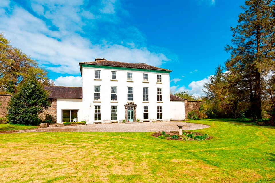 Set in 140 acres, the home includes interior trimmings, a courtyard, mountain views and a grand entrance