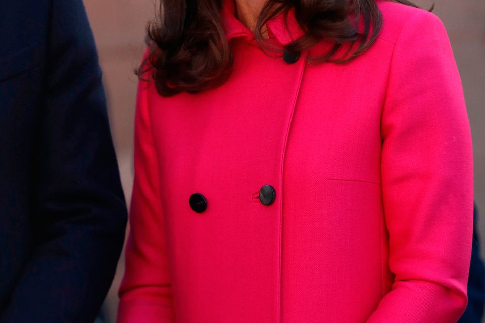 Kate Middleton wraps up baby bump in high street statement coat