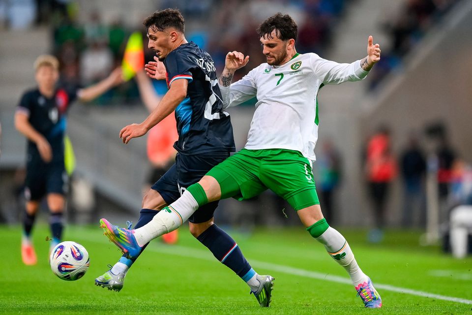Eldin Dzogovic of Luxembourg in action against Troy Parrott of Ireland at Stade de Luxembourg. Photo by Stephen McCarthy/Sportsfile
