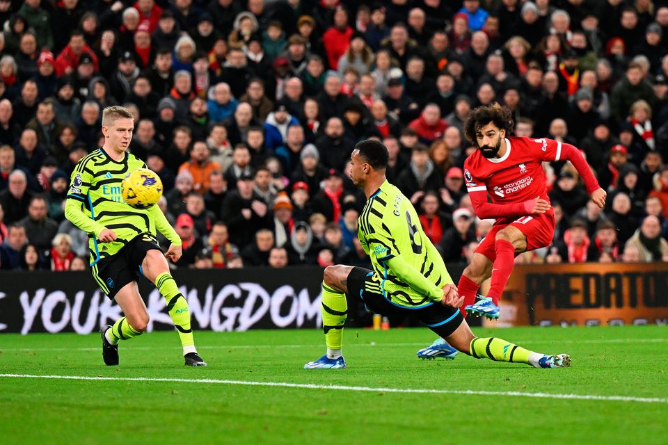 LIVERPOOL, ENGLAND - DECEMBER 23: Mohamed Salah of Liverpool scores their team's first goal during the Premier League match between Liverpool FC and Arsenal FC at Anfield on December 23, 2023 in Liverpool, England. (Photo by Michael Regan/Getty Images)