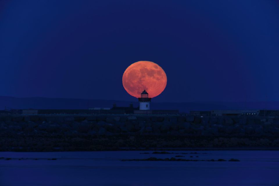 The moon over Mutton Island lighthouse in Galway. Photo: Chaosheng Zhang