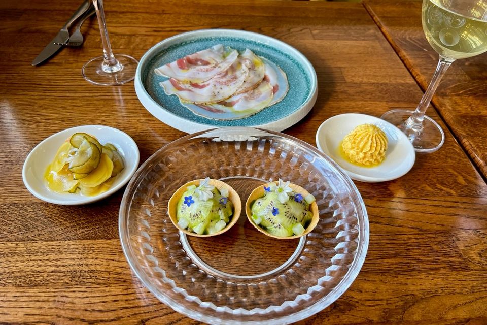 Clockwise from front: Volpe Nera’s mackerel and kiwi tartlets, pickles, pancetta arrotolata and orange and hazelnut butter. Photo: Lucinda O'Sullivan