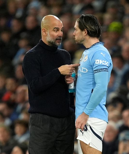 Grealish (right) appears to have fallen out of favour with manager Pep Guardiola (left) (Martin Rickett/PA)