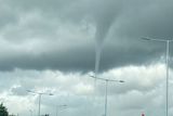 thumbnail: Funnel cloud pictured near Dublin Airport this afternoon. Picture: @GeorgieGirly100/Twitter