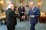 thumbnail: President Michael D Higgins shakes hands with the Prince Charles, who welcomed him to the UK for a five day state visit, at the Irish Embassy in central London