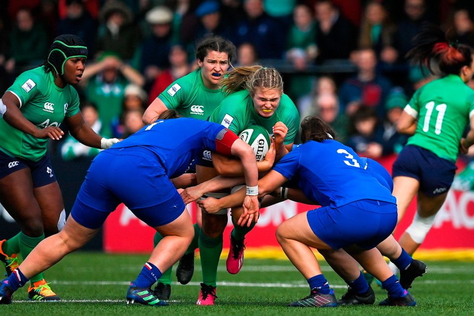 Dorothy Wall of Ireland is tackled by Clara Joyeux and Annaelle Deshayes of France