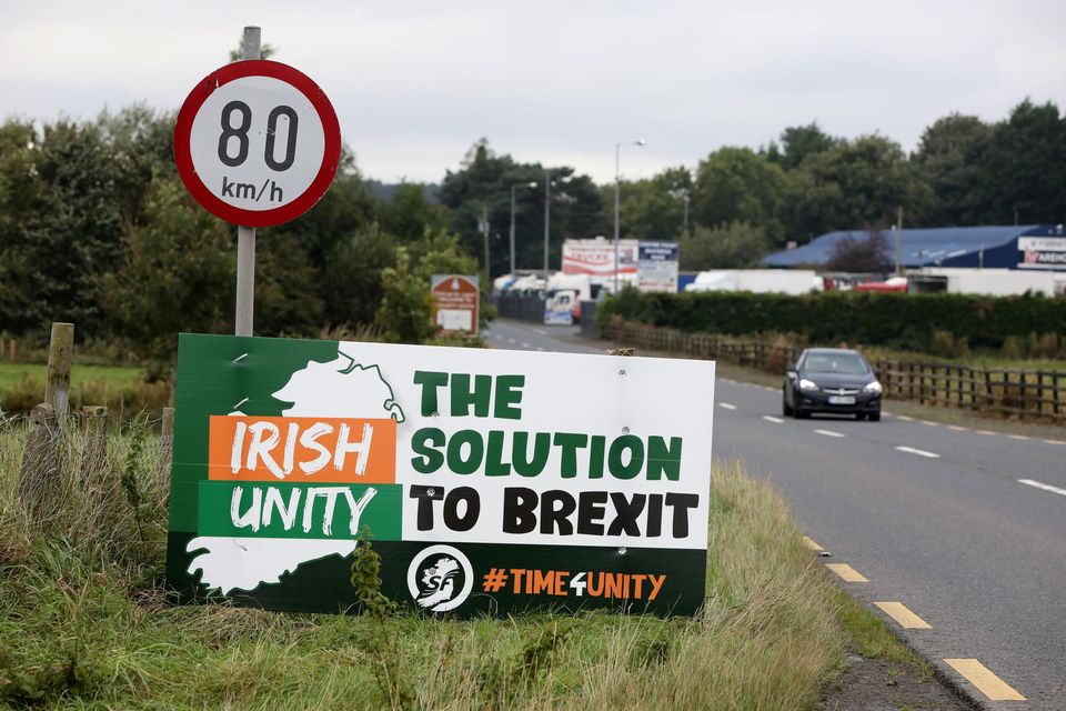 A billboard presents a solution to the problems that have emerged from Brexit. Photo: Paul Faith/AFP via Getty.