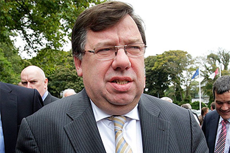 Taoiseach Brian Cowen stands in for the party photograph. Photo: Steve Humphreys