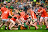 thumbnail: Ciaran Thompson of Donegal passes under pressure from Armagh players