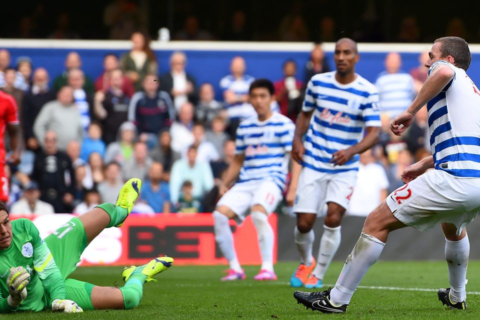 Richard Dunne of QPR scores an own goal past Alex McCarthy during the Barclays Premier League match between Queens Park Rangers and Liverpool at Loftus Road