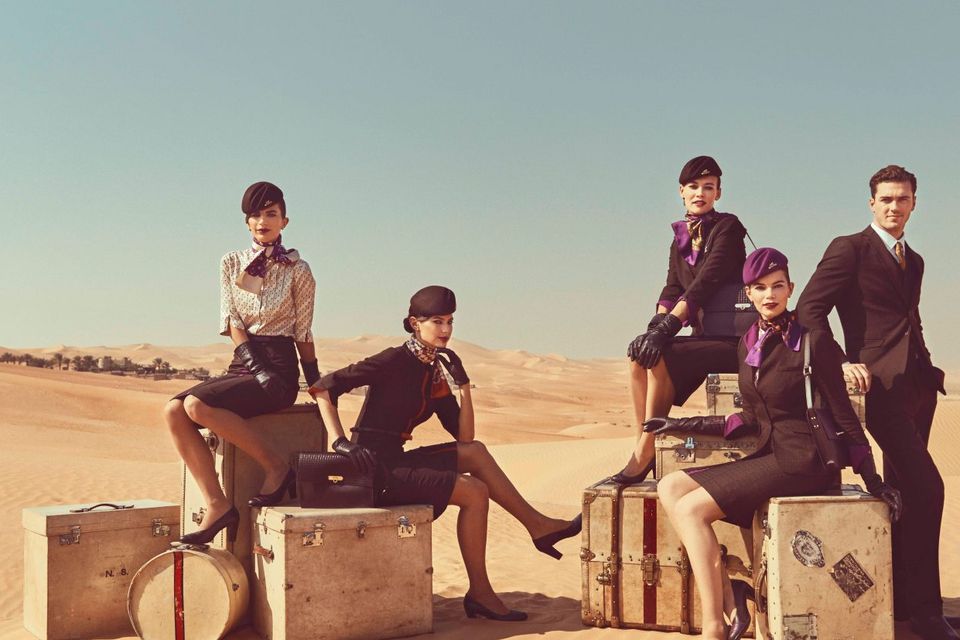 Etihad crew pose in uniforms created by Italian Haute Couturier Ettore Bilotta. Photoshoot by Norman Jean Roy.
