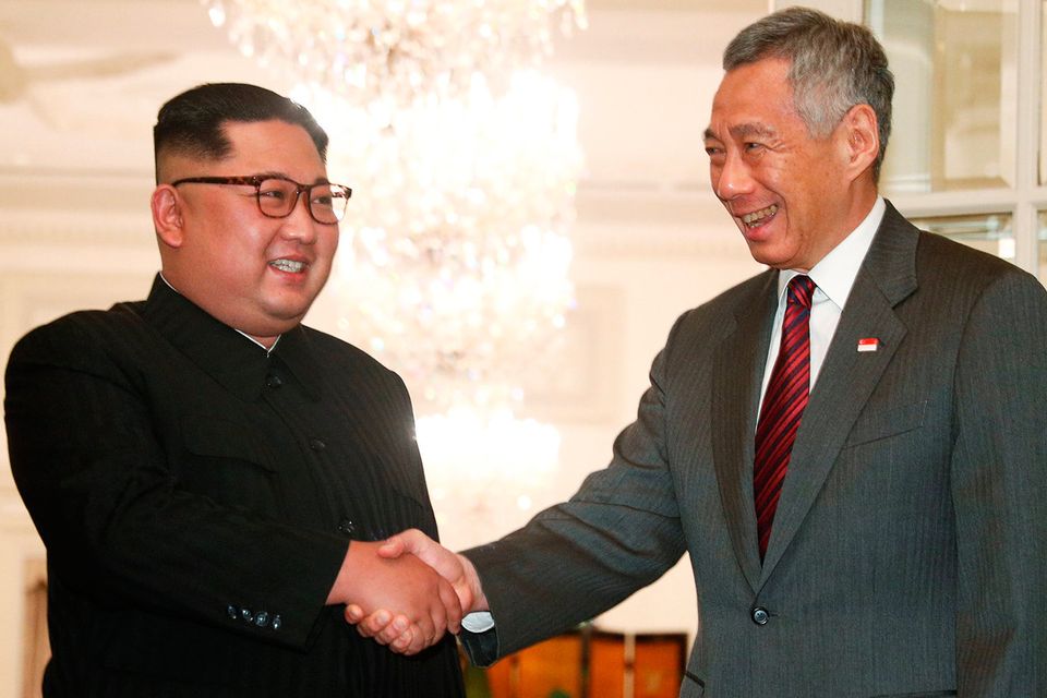 Kim Jong-un is greeted by Singapore premier Lee Hsien Loong. Photo: Reuters