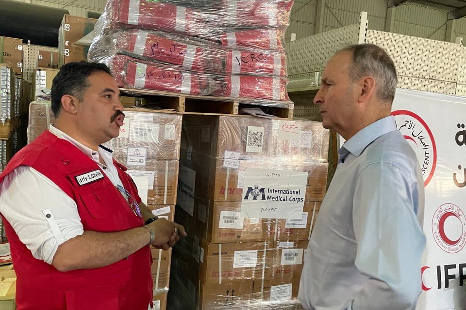 Tánaiste Micheál Martin meets with Red Crescent workers during his visit to Rafah, Egypt, on the border with Gaza.