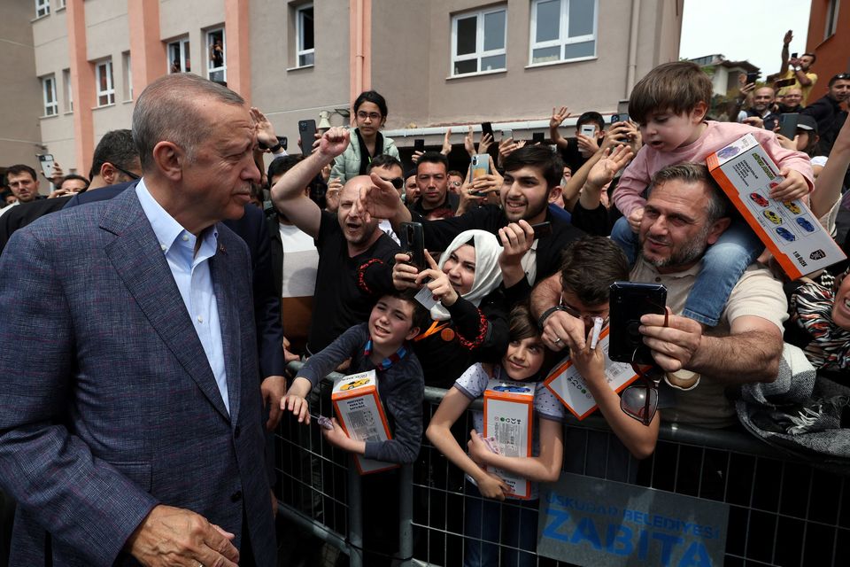 Turkish president Tayyip Erdogan greets supporters after casting his ballot in Istanbul on May 14. Photo: Reuters