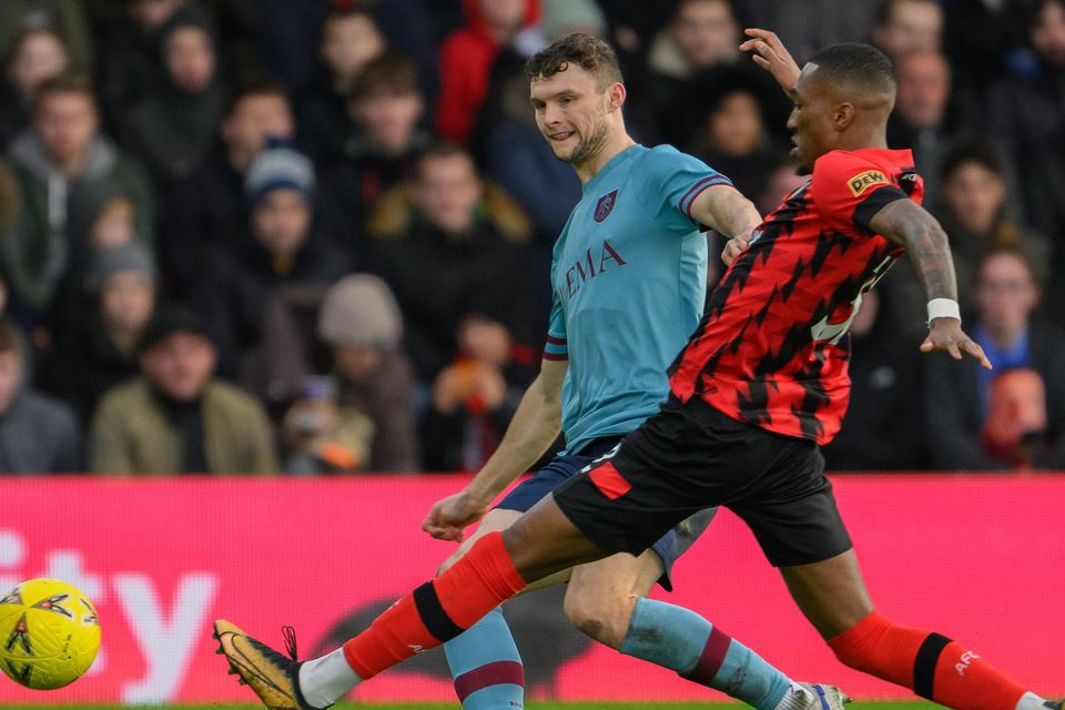 Burnley's Luke McNally (left) crosses the ball despite the attentions of Bournemouth's Jaidon Anthony (right) during the FA Cup match at the Vitality Stadium earlier this month.