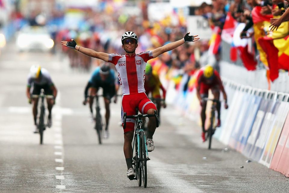 Michal Kwiatkowski of Poland celebrates winning the Men's Road Race World Championship in Ponferrada, Spain