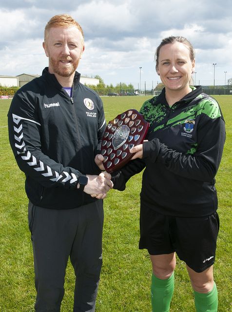 Sinead Keogh, captain of Wicklow Rovers, pictured receiving the Divisional Shield from Barry Dempsey from the WWSL. 