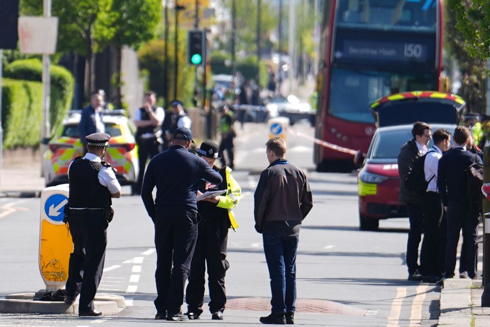 Police at the scene in Hainault, north east London, after reports of several people being stabbed at a Tube station. Photo: Jordan Pettitt/PA.