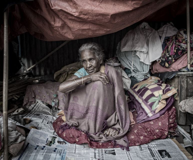 An elderly woman living in her makeshift home near Howrah bridge in Kolkata. Photo: Arthur Carron