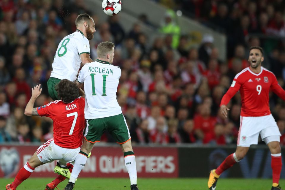 Joe Allen, left, suffers a head injury while playing for Wales on Monday night
