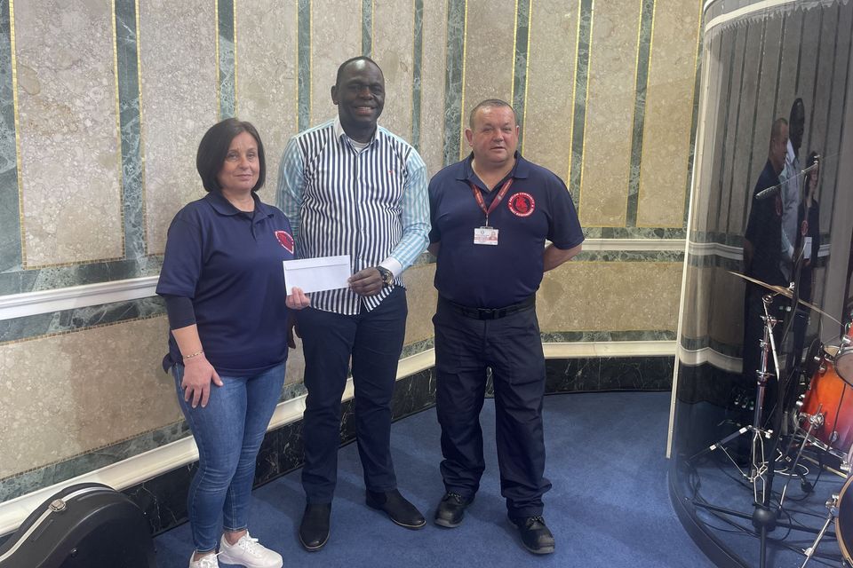  Pastor Solomon Aroboto from the Arklow Christian Community Church makes a presentation to Denise Guilifoyle and Liam Wolohan from Arklow Community First Responders.