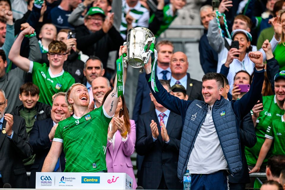 Limerick playing captain Cian Lynch, left, and injured team captain Declan Hannon celebrate as they lift the Liam MacCarthy Cup. Photo by Brendan Moran/Sportsfile