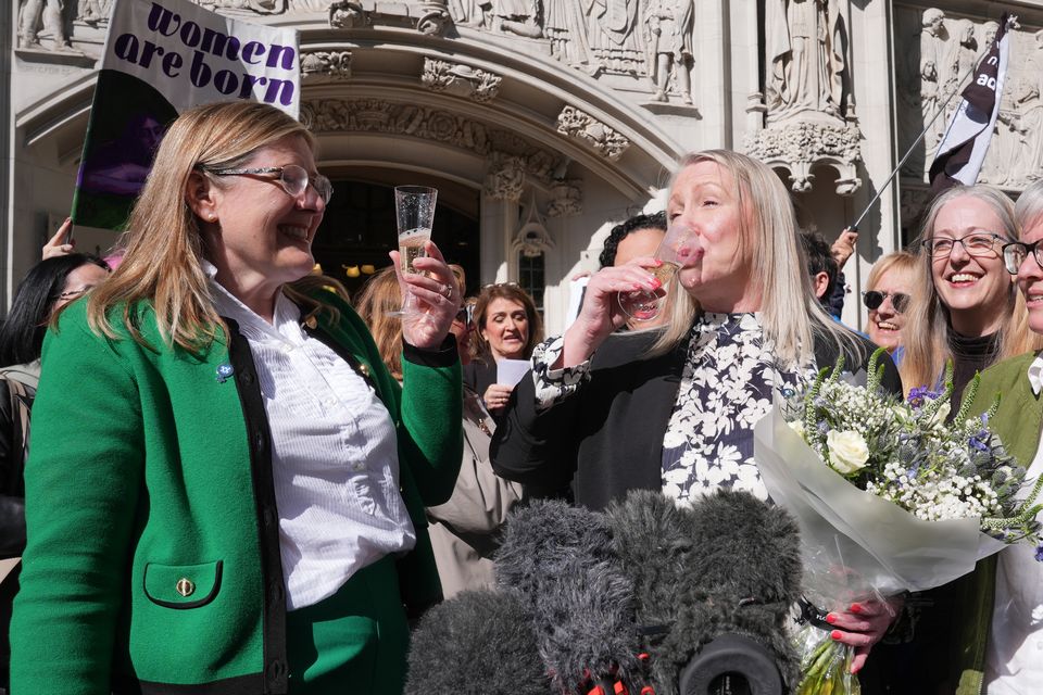 Susan Smith and Marion Calder, co-directors of For Women Scotland, and campaigners celebrate outside the Supreme Court (Lucy North/PA)