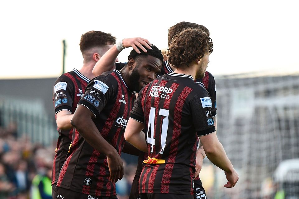 James Akintunde is congratulated by his Bohemians teammates for his vital goal