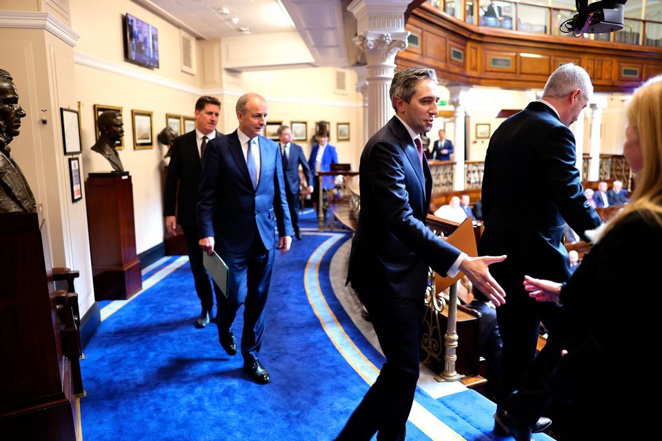 Simon Harris, Micheál Martin and Eamon Ryan inside the Dáil. Photo: PA