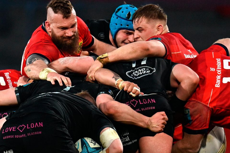RG Snyman (left) and Gavin Coombes of Munster try to halt an Edinburgh maul during the URC match at Thomond Park. Photo: Harry Murphy/Sportsfile