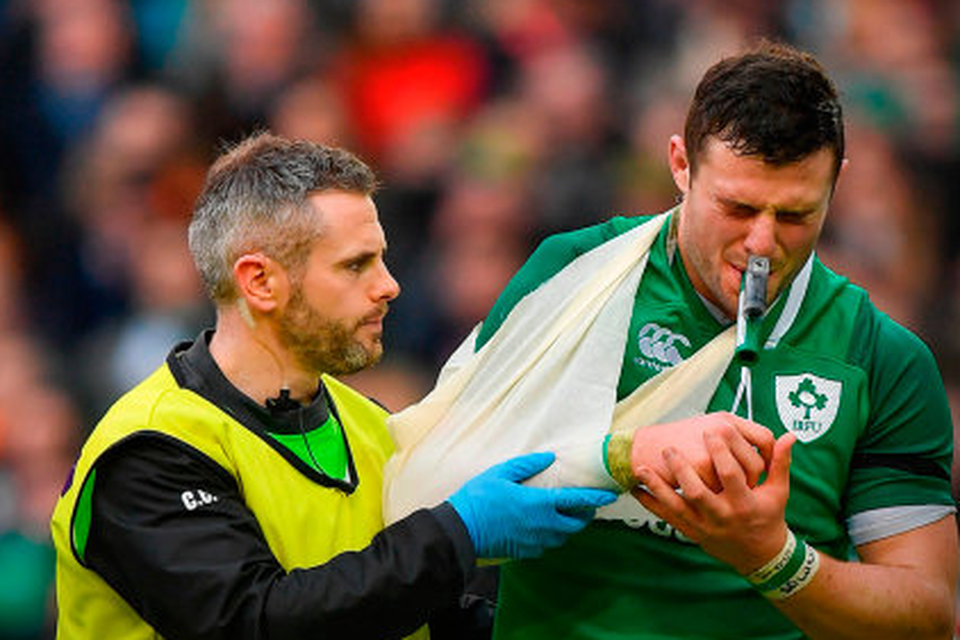 AGONY: Ireland’s Robbie Henshaw grimaces as he leaves the pitch with a shoulder injury during the Six Nations match against Italy at the Aviva Stadium on Saturday. Pic: Sportsfile