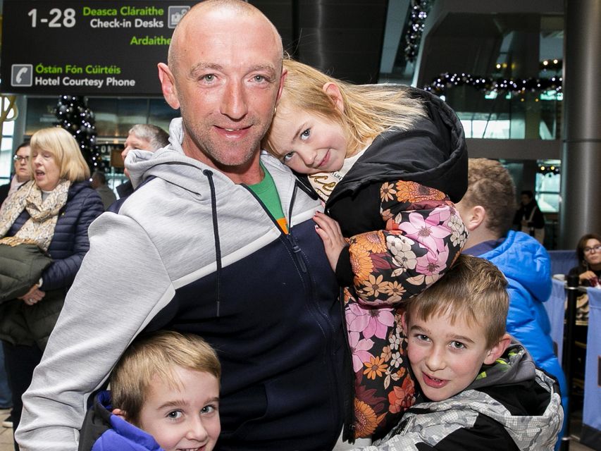 David Whitney from Perth greets his children Nathan (8), Jodi (4) & Cal (6) from Wexford. Photo: Gareth Chaney/ Collins Photos