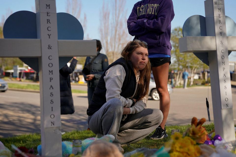 Locals visit a memorial at the entrance to the Covenant School in Nashville, Tennessee. Photo: Cheney Orr/Reuters