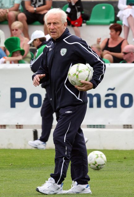 Republic of Ireland soccer team new coach Giovanni Trapattoni, from Italy, watches the players warm up before a friendly match with local team Portimonense in Portimao, Portugal, Sunday, May 18 2008.