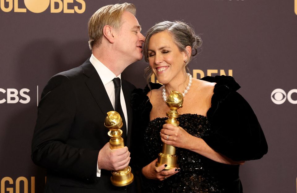 Christopher Nolan and Emma Thomas pose with the awards for Best Director and Best Motion Picture - Drama for "Oppenheimer" at the 81st Annual Golden Globe Awards in Beverly Hills, California, U.S., January 7, 2024. REUTERS/Mario Anzuoni