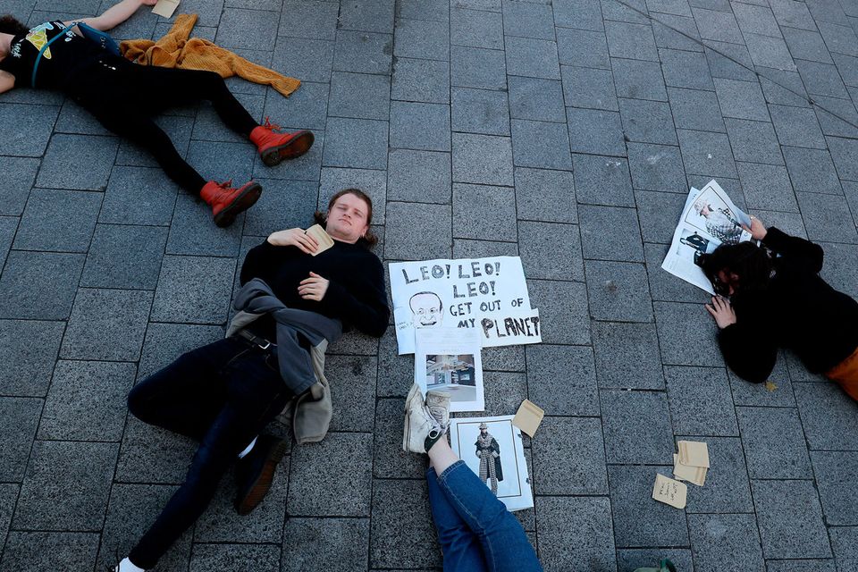 Protests: activists from Climate Action Dublin Bay South stage a die-in in Ranelagh, Dublin ahead of the Global Climate Strike which runs until September 27. Photo by rian Lawless/PA Wire
