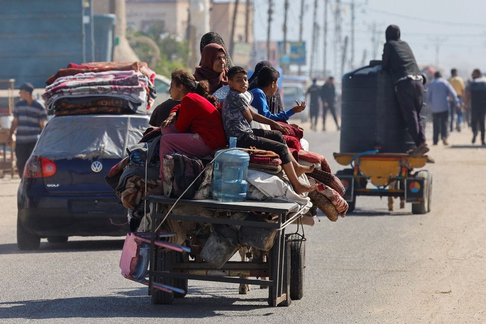 Palestinians travel in an animal-drawn cart as they flee Rafah after Israeli forces launched a ground and air operation in the eastern part of the southern Gaza city. Reuters