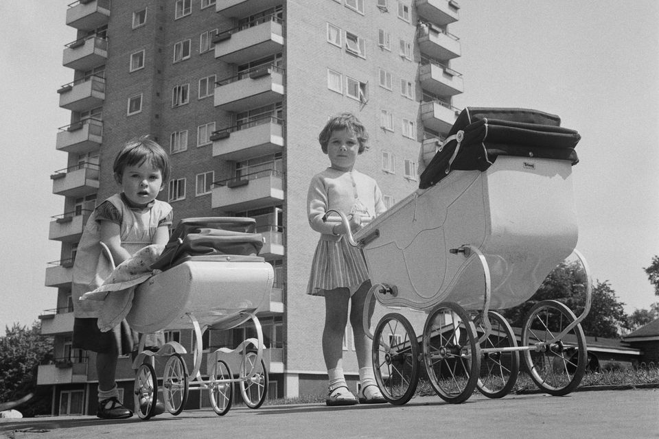Little girls play with prams in the early 1960s. Photo: Getty