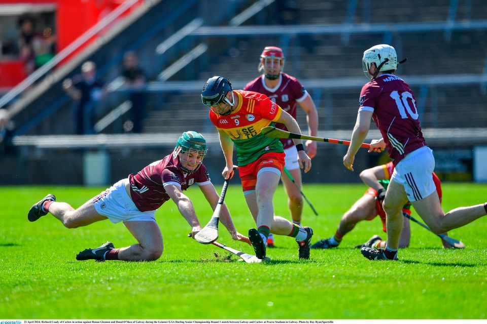 Richard Coady of Carlow in action against Ronan Glennon and Donal O’Shea of Galway during the Leinster SHC round one match at Pearse Stadium in Galway. Photo: Ray Ryan/Sportsfile