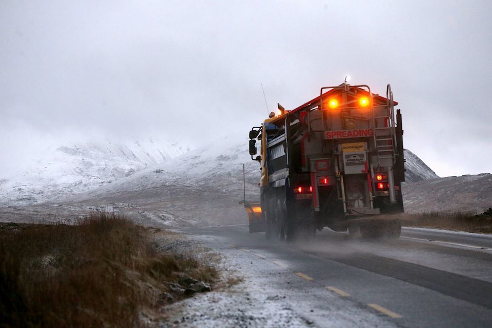 A snow plough grits the road near Glenveagh National Park, Co Donegal