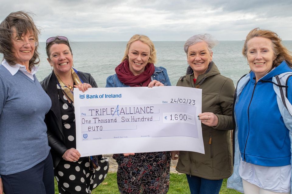 Aisling Foran of Triple A Alliance (centre), receives a cheque from Michelle Dempsey, Róisín O'Connell, Hazel Evans and Rita Wall of Delgany's Bella Voce choir.