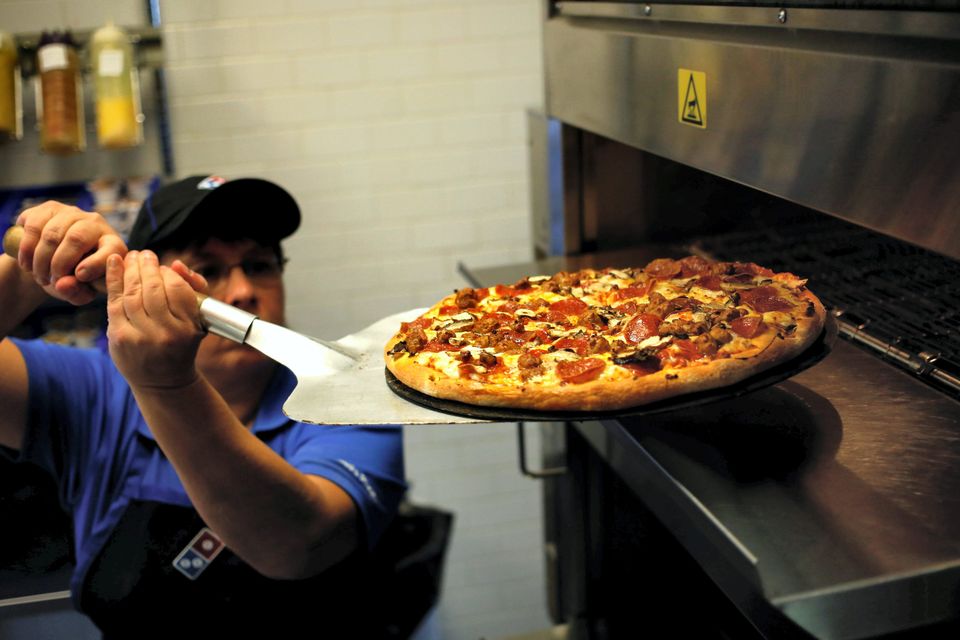 Domino's Pizza is looking at splitting some of its stores in Dublin into two separate operations because they're so busy