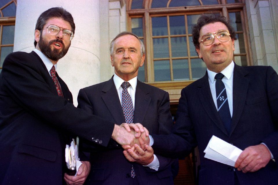 Former Sinn Féin leader Gerry Adams, then Taoiseach Albert Reynolds and former SDLP leader John Hume shake hands after their meeting at Government Buildings in Dublin on September 6, 1994. Photo: Kevin Lamarque/Reuters