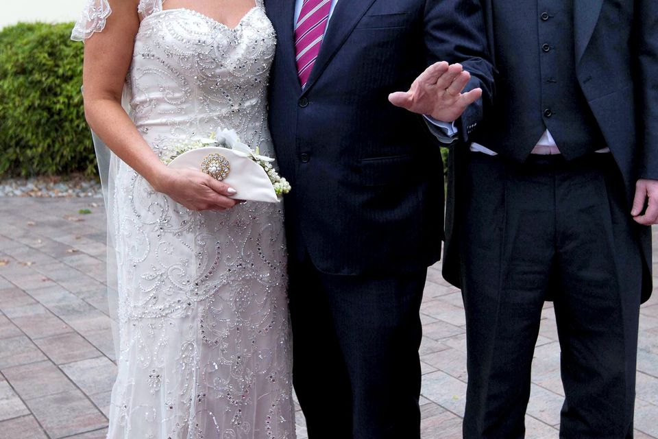 Taoiseach Enda Kenny congratulates Stacy O'Neill and Bryan Atkinson from Cork as they arrive for their wedding reception. Picture: Photocall