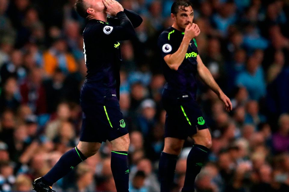 Everton's Wayne Rooney (left) celebrates scoring his side's first goal