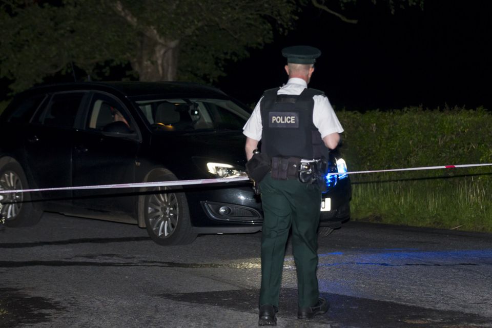 Police at the house Picture: Kevin Scott/Belfast Telegraph