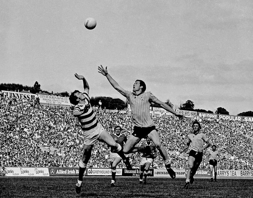 Barney Rock of Dublin contests a high ball with Cork goalkeeper Michael Creedon