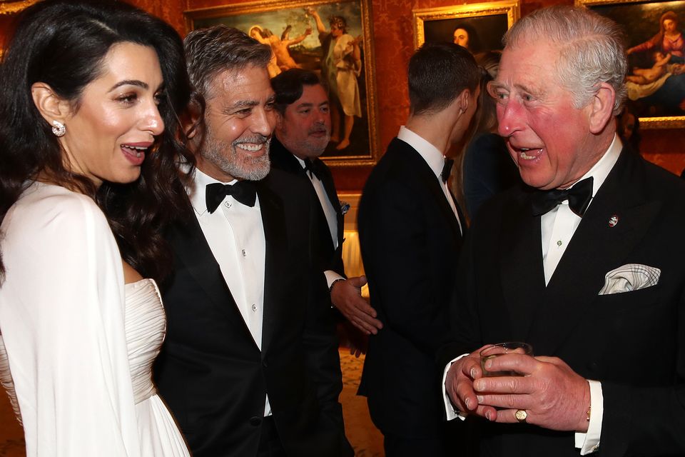The Prince of Wales speaks to Amal and George Clooney (Chris Jackson/PA)