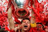 thumbnail: File photo dated 25-05-2005 of Liverpool captain Steven Gerrard lifts the UEFA Champions League trophy. 
Phil Noble/PA Wire.